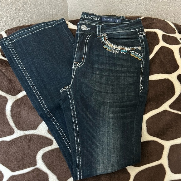Grace jeans with blue brown and sliver trim around the pockets. - Picture 1 of 4